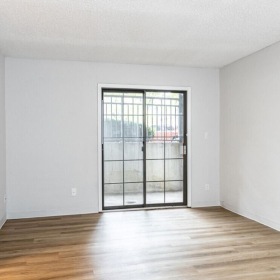 an empty room with a glass door